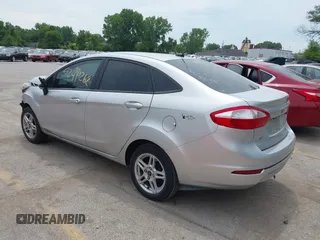2018 Ford Fiesta SE z VIN 3FADP4BJ6JM106855, wystawiony jako IAAI lot #42491262 z przebiegiem 166 397 mil mil oraz . Historia ofert i sprzedaży dostępna na DreamBid. Obrazek 3.