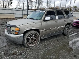 2001 GMC Yukon SLT with VIN 1GKEC13T51J145673, listed as a Copart auction lot 83568954 with 310,415 mi miles and Salvage Title. Bid and sale history available at carsss.com. Image 1.