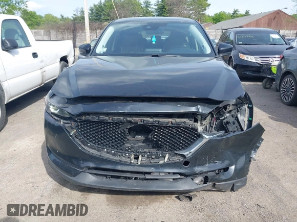 2018 Mazda CX-5 Touring z VIN JM3KFBCM9J0358997, wystawiony jako IAAI lot #42332606 z przebiegiem 93 952 mil mil oraz . Historia ofert i sprzedaży dostępna na DreamBid. Obrazek 12.