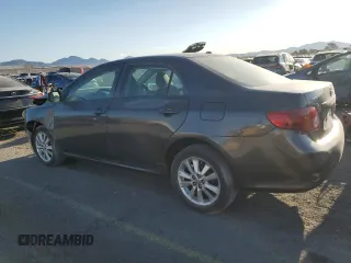 2010 Toyota Corolla with VIN 2T1BU4EE1AC363990, listed as a Copart auction lot 52001595 with 244,000 mi miles and Salvage title. Bid and sale history available at DreamBid. Image 2.