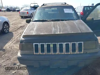 1993 Jeep Grand Cherokee Laredo with VIN 1J4GZ58S1PC680016, listed as a IAAI auction lot 41813392 with 149,520 mi miles. Bid and sale history available at carsss.com. Image 6.