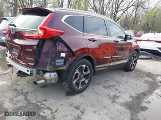 2017 Honda CR-V Touring with VIN 5J6RW2H95HL074264, listed as a IAAI auction lot 41974804 with 94,923 mi miles. Bid and sale history available at carsss.com. Image 4.