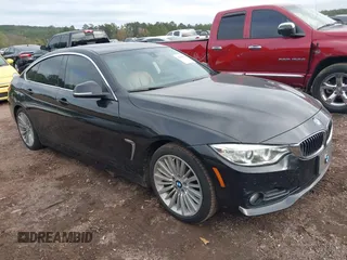 2015 BMW 4 Series 428i z VIN WBA4A9C50FGL86698, wystawiony jako IAAI lot #40769577 z przebiegiem 119 565 mil mil oraz . Historia ofert i sprzedaży dostępna na DreamBid. Obrazek 1.