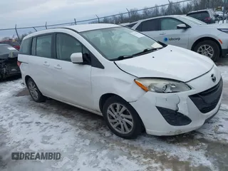 2012 Mazda 5 Sport z VIN JM1CW2BL6C0124440, wystawiony jako IAAI lot #41378536 z przebiegiem 157 262 mil mil oraz . Historia ofert i sprzedaży dostępna na DreamBid. Obrazek 1.