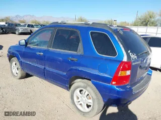 2006 Kia Sportage LX with VIN KNDJF723267158472, listed as a IAAI auction lot 41518202 with 123,178 mi miles. Bid and sale history available at carsss.com. Image 3.