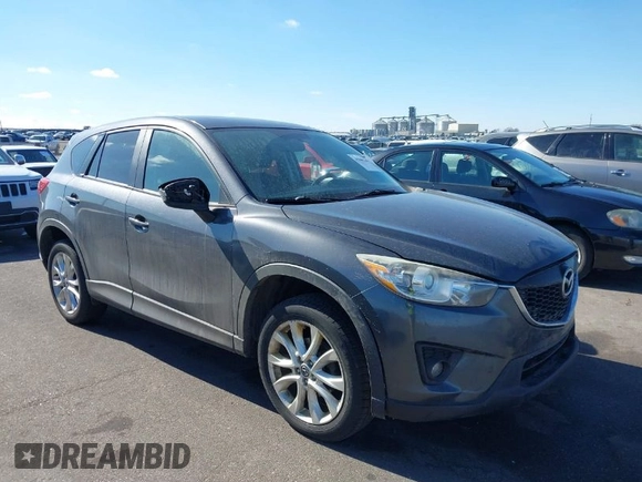 2014 Mazda CX-5 Grand Touring with VIN JM3KE4DY1E0364685, listed as a IAAI auction lot 41665349 with 135,751 mi miles. Bid and sale history available at carsss.com. Image 1.