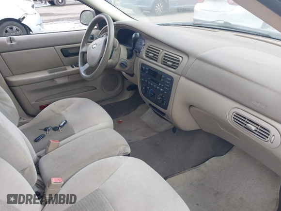 2006 Ford Taurus SE with VIN 1FAFP53U56A209213, listed as a IAAI auction lot 42009423 with 118,083 mi miles. Bid and sale history available at carsss.com. Image 5.