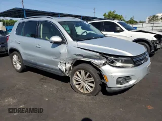 2012 Volkswagen Tiguan SEL with VIN WVGAV7AXXCW521394, listed as a Copart auction lot 53000555 with 126,017 mi miles and Salvage Title. Bid and sale history available at DreamBid. Image 4.
