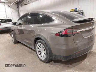 2016 Tesla Model X 70D with VIN 5YJXCBE27GF004974, listed as a IAAI auction lot 41630556 with 167,709 mi miles. Bid and sale history available at carsss.com. Image 3.