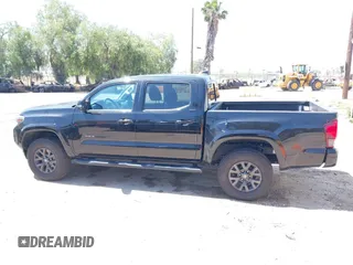 2023 Toyota Tacoma SR with VIN 3TMCZ5AN1PM654572, listed as a IAAI auction lot 42312575 with 14,111 mi miles and . Bid and sale history available at DreamBid. Image 14.