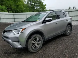 2018 Toyota RAV4 XLE with VIN JTMRFREV2JJ200677, listed as a Copart auction lot 59660535 with 82,283 mi miles and Salvage title. Bid and sale history available at DreamBid. Image 1.