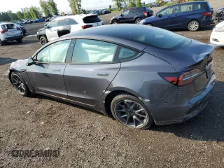 2023 Tesla Model 3 with VIN 5YJ3E1EA8PF692428, listed as a Copart auction lot 64667414 with 16,704 mi miles and Salvage Title. Bid and sale history available at DreamBid. Image 2.