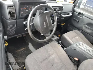 2005 Jeep Wrangler Unlimited with VIN 1J4FA44S75P358246, listed as a Copart auction lot 60958695 with 150,003 mi miles and Salvage title. Bid and sale history available at DreamBid. Image 8.