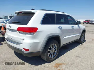 2014 Jeep Grand Cherokee Limited with VIN 1C4RJEBG6EC453833, listed as a IAAI auction lot 41901390 with 148,576 mi miles and . Bid and sale history available at DreamBid. Image 4.