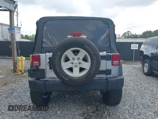 2014 Jeep Wrangler Unlimited Sport with VIN 1C4BJWDG3EL135351, listed as a IAAI auction lot 41947408 with 104,460 mi miles. Bid and sale history available at carsss.com. Image 16.