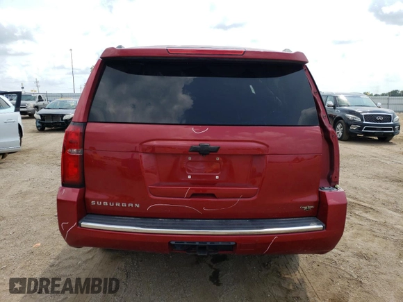 2015 Chevrolet Suburban LTZ with VIN 1GNSKKKC6FR556105, listed as a Copart auction lot 64034304 with 106,269 mi miles and Salvage Title. Bid and sale history available at DreamBid. Image 6.