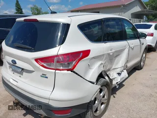 2014 Ford Escape SE with VIN 1FMCU9G94EUB01239, listed as a IAAI auction lot 42628460 with 122,032 mi miles and . Bid and sale history available at DreamBid. Image 4.