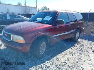 2001 GMC Jimmy SL with VIN 1GKCS13W012143344, listed as a IAAI auction lot 41385552 with 216,127 mi miles. Bid and sale history available at carsss.com. Image 2.