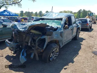 2023 Ford F-150 XL with VIN 1FTFW1E53PKD99214, listed as a IAAI auction lot 42211755 with 31 mi miles and . Bid and sale history available at DreamBid. Image 2.