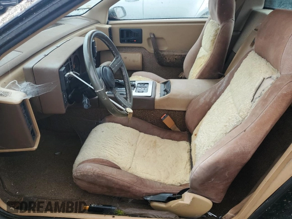 1984 Pontiac Fiero z VIN 1G2AF37R6EP320306, wystawiony jako Copart lot #68255394 z przebiegiem 49 284 mil mil oraz Czysty tytuł • Clean title. Historia ofert i sprzedaży dostępna na DreamBid. Obrazek 7.