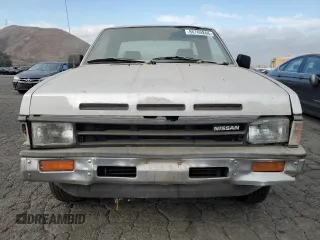 1988 Nissan Hardbody z VIN 1N6ND16S7JC395431, wystawiony jako Copart lot #86765244 z przebiegiem 99 134 mil mil oraz Tytuł czysty. Historia ofert i sprzedaży dostępna na DreamBid. Obrazek 5.