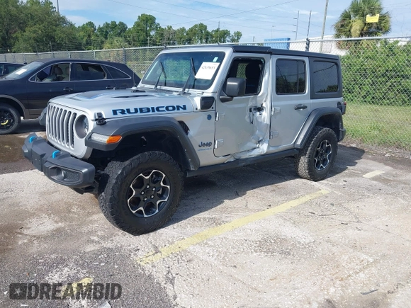 2023 Jeep Wrangler Rubicon with VIN 1C4JJXR63PW703424, listed as a IAAI auction lot 42639653 with 46,412 mi miles and . Bid and sale history available at DreamBid. Image 2.