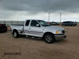 1999 Ford F-150 with VIN 1FTRX07W0XKB88434, listed as a Copart auction lot 60063135 with 277,188 mi miles and Salvage title. Bid and sale history available at DreamBid. Image 14.