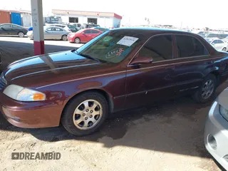 2002 Mazda 626 LX with VIN 1YVGF22C225291987, listed as a IAAI auction lot 41863018 with 111,362 mi miles. Bid and sale history available at carsss.com. Image 2.