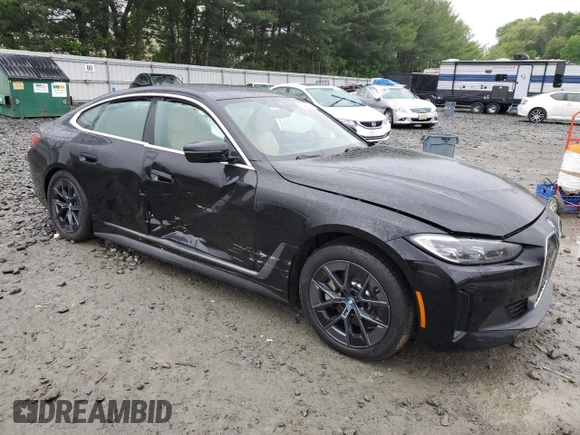 2024 BMW i4 eDrive35 with VIN WBY43AW05RFS84773, listed as a Copart auction lot 54974024 with 2,942 mi miles and Salvage Title. Bid and sale history available at carsss.com. Image 4.