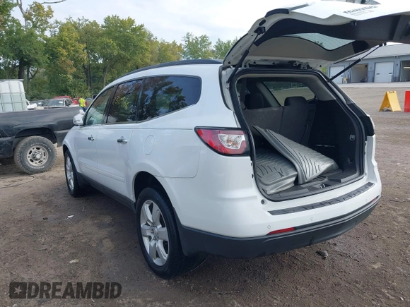 2017 Chevrolet Traverse LT with VIN 1GNKRGKD4HJ338716, listed as a IAAI auction lot 40265414 with 131,097 mi miles and . Bid and sale history available at DreamBid. Image 3.