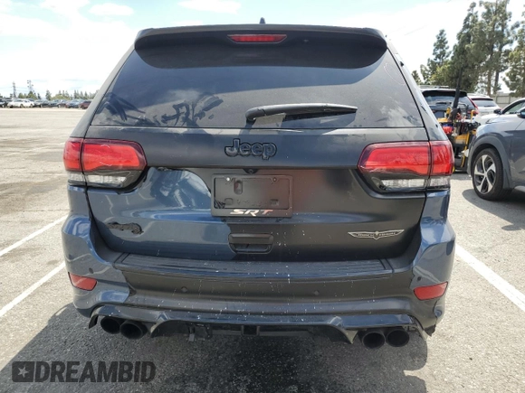 2020 Jeep Grand Cherokee Trackhawk z VIN 1C4RJFN94LC314087, wystawiony jako Copart lot #51484835 z przebiegiem 38 306 mil mil oraz Szkoda całkowita • Salvage title. Historia ofert i sprzedaży dostępna na DreamBid. Obrazek 6.