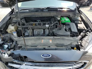 2017 Ford Fusion SE z VIN 3FA6P0H74HR390898, wystawiony jako Copart lot #58958275 z przebiegiem 159 799 mil mil oraz Szkoda całkowita • Salvage title. Historia ofert i sprzedaży dostępna na DreamBid. Obrazek 11.
