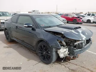 2016 Scion tC with VIN JTKJF5C76GJ017584, listed as a IAAI auction lot 41938981 with 121,166 mi miles. Bid and sale history available at carsss.com. Image 1.