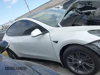2024 Tesla Model Y with VIN 7SAYGDED2RF207783, listed as a IAAI auction lot 41758143 with Not Provided miles and . Bid and sale history available at DreamBid. Image 13.