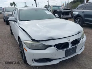 2015 BMW 3 Series 328i with VIN WBA3A5G55FNS85277, listed as a IAAI auction lot 41593498 with 128,265 mi miles. Bid and sale history available at carsss.com. Image 1.