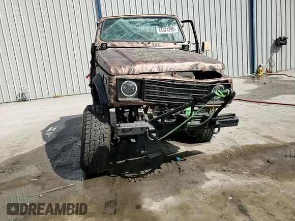 1988 Suzuki Samurai z VIN JS4JC51C6J4271251, wystawiony jako Copart lot #44574795 z przebiegiem 14 542 mil mil oraz Szkody całkowita. Historia ofert i sprzedaży dostępna na DreamBid. Obrazek 11.
