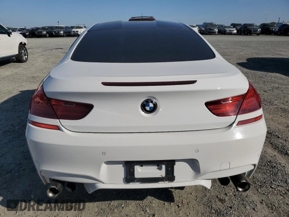 2014 BMW M6 z VIN WBSLX9C51ED160143, wystawiony jako Copart lot #50762185 z przebiegiem 91 718 mil mil oraz Szkody całkowita. Historia ofert i sprzedaży dostępna na DreamBid. Obrazek 6.