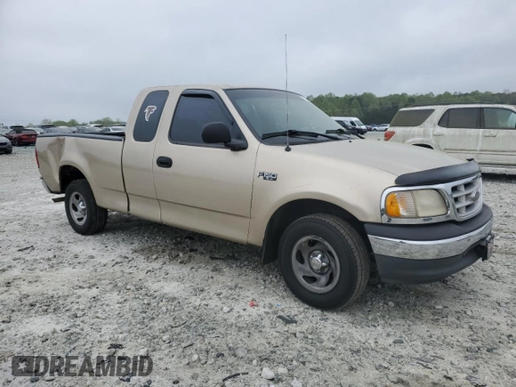 1999 Ford F-150 with VIN 1FTZX1721XNA37541, listed as a Copart auction lot 51588415 with 267,071 mi miles and Salvage title. Bid and sale history available at DreamBid. Image 4.
