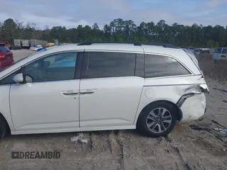 2014 Honda Odyssey Touring with VIN 5FNRL5H97EB127836, listed as a IAAI auction lot 41497413 with 174,914 mi miles and . Bid and sale history available at DreamBid. Image 14.