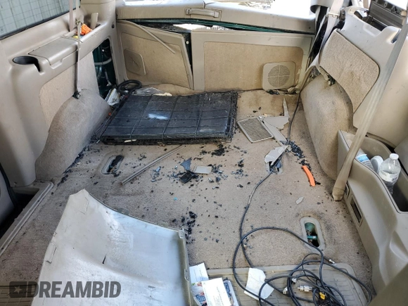 2003 GMC Safari z VIN 1GKEL19X83B512525, wystawiony jako Copart lot #79059984 z przebiegiem 122 800 mil mil oraz Szkody całkowita. Historia ofert i sprzedaży dostępna na DreamBid. Obrazek 10.