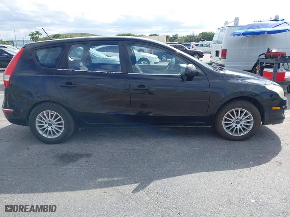 2010 Hyundai Elantra Touring GLS with VIN KMHDB8AE7AU075949, listed as a IAAI auction lot 41426249 with 231,611 mi miles. Bid and sale history available at carsss.com. Image 6.