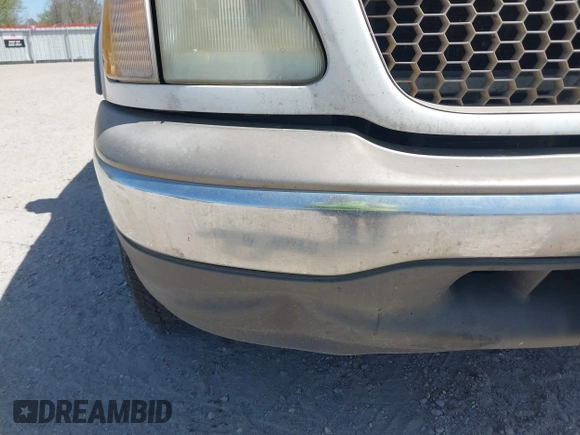 2003 Ford F-150 XL with VIN 1FTRX17L03NA16778, listed as a IAAI auction lot 41602179 with 219,101 mi miles. Bid and sale history available at carsss.com. Image 6.
