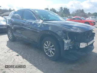 2019 Mazda CX-9 Touring z VIN JM3TCBCY0K0317028, wystawiony jako IAAI lot #41814713 z przebiegiem 155 280 mil mil oraz . Historia ofert i sprzedaży dostępna na DreamBid. Obrazek 1.