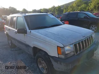 1998 Jeep Grand Cherokee Laredo z VIN 1J4GZ58S4WC369551, wystawiony jako IAAI lot #42831802 z przebiegiem 207 814 mil mil oraz . Historia ofert i sprzedaży dostępna na DreamBid. Obrazek 1.