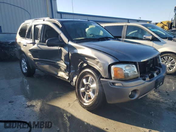 2005 GMC Envoy SLT with VIN 1GKDS13SX52322725, listed as a Copart auction lot 82032674 with 249,288 mi miles and Salvage Title. Bid and sale history available at carsss.com. Image 4.