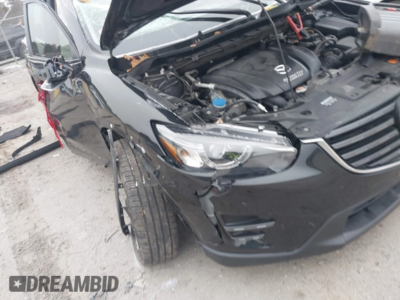 2016 Mazda CX-5 Grand Touring with VIN JM3KE4DY1G0685449, listed as a IAAI auction lot 41162840 with 134,525 mi miles. Bid and sale history available at carsss.com. Image 6.