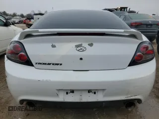 2008 Hyundai Tiburon GS z VIN KMHHM66DX8U290154, wystawiony jako Copart lot #67054434 z przebiegiem 191 963 mil mil oraz Nie do naprawy • Non repairable. Historia ofert i sprzedaży dostępna na DreamBid. Obrazek 6.