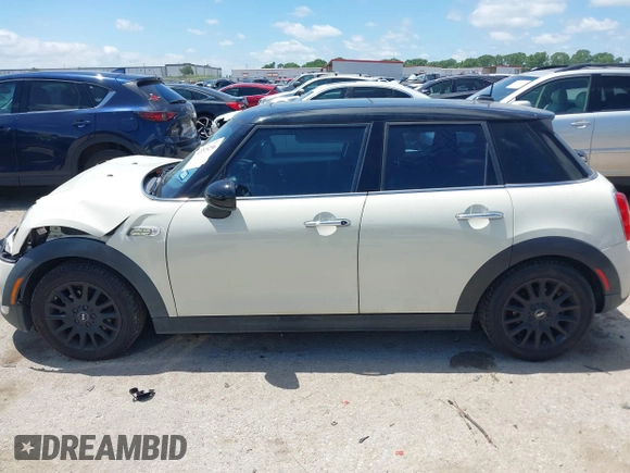 2016 MINI Hardtop 4 Door z VIN WMWXU1C50G2D08848, wystawiony jako IAAI lot #42215256 z przebiegiem 102 643 mil mil oraz . Historia ofert i sprzedaży dostępna na DreamBid. Obrazek 15.