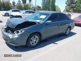 2004 Toyota Camry LE with VIN 4T1BF30K64U067898, listed as a IAAI auction lot 42131958 with 209,702 mi miles. Bid and sale history available at carsss.com. Image 2.