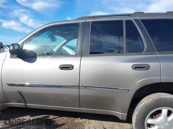 2007 GMC Envoy SLE with VIN 1GKDS13S372241844, listed as a IAAI auction lot 41575443 with 144,726 mi miles. Bid and sale history available at carsss.com. Image 14.